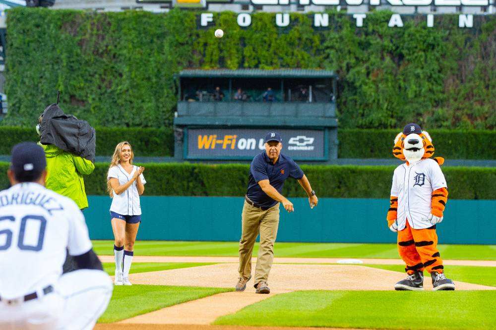 Man throwing pitch to Detroit Tigers player